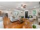 Inviting living room featuring hardwood floors, an open layout, and a seamless transition to the kitchen at 502 Allgood Ne Rd, Marietta, GA 30060