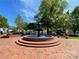 The historic fountain in Marietta Square, surrounded by benches and greenery at 502 Allgood Ne Rd, Marietta, GA 30060
