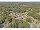 Expansive aerial view of the neighborhood, showcasing the surrounding trees and nearby homes at 6684 Birch Rd, Winston, GA 30187