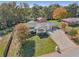 Beautiful aerial view of the property highlighting the mature trees and spacious yard at 6684 Birch Rd, Winston, GA 30187