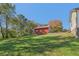 Large backyard with an outbuilding and treeline at 6684 Birch Rd, Winston, GA 30187