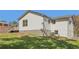 Back exterior featuring white siding, a small deck, and a sprawling yard at 6684 Birch Rd, Winston, GA 30187