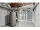 Unfinished basement with water heater, painted walls and ceiling ductwork at 6684 Birch Rd, Winston, GA 30187