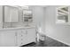 Bathroom featuring hexagon floor tile, double vanity and a bright window at 6684 Birch Rd, Winston, GA 30187