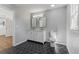Updated bathroom featuring a double vanity, hexagon tile flooring, and a window at 6684 Birch Rd, Winston, GA 30187