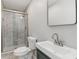 Updated bathroom with a glass-enclosed shower, modern sink, and tile flooring at 6684 Birch Rd, Winston, GA 30187