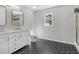 Bathroom featuring hexagon floor tile, double vanity and a glass enclosed shower at 6684 Birch Rd, Winston, GA 30187