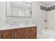 Bathroom boasts a modern double vanity with quartz countertop and tiled shower at 6684 Birch Rd, Winston, GA 30187