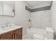 Bathroom with a modern vanity and quartz countertop complemented by tiled shower at 6684 Birch Rd, Winston, GA 30187