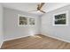 A light and airy bedroom featuring wood-look floors and natural light at 6684 Birch Rd, Winston, GA 30187