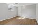 Bedroom with neutral walls and wood-look floors, a window and a flush mount ceiling fan at 6684 Birch Rd, Winston, GA 30187