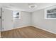 Bright bedroom featuring wood-look floors, neutral walls and modern ceiling fan light at 6684 Birch Rd, Winston, GA 30187