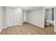 Bedroom featuring wood-look floors and a connecting bathroom with marbled tile at 6684 Birch Rd, Winston, GA 30187