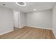 Spacious bedroom with wood-look floors, neutral walls and bright lighting at 6684 Birch Rd, Winston, GA 30187