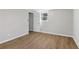 Cozy bedroom with wood-look floors, neutral walls and natural light from a window at 6684 Birch Rd, Winston, GA 30187