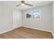 Bedroom with ceiling fan, wood floors, closet, and natural light from a window at 6684 Birch Rd, Winston, GA 30187