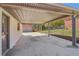 Covered carport and driveway to detached garage at 6684 Birch Rd, Winston, GA 30187