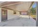 Spacious covered carport area featuring convenient access to the house at 6684 Birch Rd, Winston, GA 30187