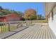 A spacious deck with a view of the backyard and garage outbuilding at 6684 Birch Rd, Winston, GA 30187
