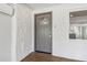 Inviting entryway with textured stone walls, luxury vinyl plank floors, and stylish front door at 6684 Birch Rd, Winston, GA 30187