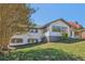 Charming one-story home with white brick and vinyl siding, an American flag and landscaped yard at 6684 Birch Rd, Winston, GA 30187