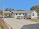 Exterior of home with a carport and newly stained deck at 6684 Birch Rd, Winston, GA 30187