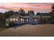 Exterior of home highlighting the large driveway and well-maintained yard at 6684 Birch Rd, Winston, GA 30187