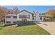 Charming one-story home with white brick and vinyl siding, an American flag and landscaped yard at 6684 Birch Rd, Winston, GA 30187