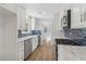 Bright kitchen featuring stainless steel appliances, white cabinets, and subway tile backsplash at 6684 Birch Rd, Winston, GA 30187