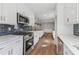 View of the kitchen featuring new stainless steel appliances and a center island at 6684 Birch Rd, Winston, GA 30187