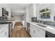 Modern kitchen with stainless steel appliances, white cabinetry, and granite countertops at 6684 Birch Rd, Winston, GA 30187