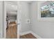 Laundry room with hookups for washer/dryer, new floors, and a view to the kitchen at 6684 Birch Rd, Winston, GA 30187
