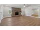 Bright living room with hardwood floors, a fireplace, and abundant natural light at 6684 Birch Rd, Winston, GA 30187