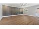 Well-lit living room showcasing hardwood floors, wall paneling, and modern fixtures at 6684 Birch Rd, Winston, GA 30187