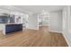 Open living space leading to a stylish kitchen with hardwood floors and modern fixtures at 6684 Birch Rd, Winston, GA 30187