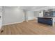 Inviting living room flowing into an open-concept kitchen with hardwood floors at 6684 Birch Rd, Winston, GA 30187