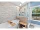 Serene bathroom boasts modern tub and separate shower with light blue walls and many windows at 100 Karla Ct, Roswell, GA 30076