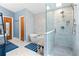 Beautiful bathroom with standalone tub, walk-in shower, modern fixtures, and stylish blue accents at 100 Karla Ct, Roswell, GA 30076