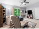 Relaxing bedroom space with reading chair and ottoman, featuring a sliding glass door at 100 Karla Ct, Roswell, GA 30076