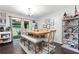 Dining room with modern lighting, hardwood floors, large table, and access to the outdoors at 100 Karla Ct, Roswell, GA 30076