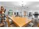 Open concept dining area connects seamlessly to the living room and kitchen with hardwood floors at 100 Karla Ct, Roswell, GA 30076