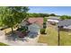 Aerial view of a well-kept home with lush landscaping, green lawn and a spacious driveway at 327 Stone Valley Xing, Canton, GA 30114