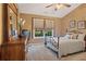 Cozy bedroom features a metal bed frame, neutral paint, carpeted floors and a window at 327 Stone Valley Xing, Canton, GA 30114