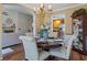 Comfortable dining room with chandelier, round table and easy access to the kitchen and living room at 327 Stone Valley Xing, Canton, GA 30114