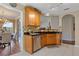 Well-equipped kitchen with wooden cabinets, stainless steel appliances, and a view into the dining area at 327 Stone Valley Xing, Canton, GA 30114