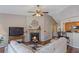 Inviting living room with a fireplace, wood floors, and comfortable seating area at 327 Stone Valley Xing, Canton, GA 30114