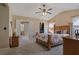 Spacious main bedroom features a ceiling fan, ensuite bathroom access, and a walk-in closet at 327 Stone Valley Xing, Canton, GA 30114