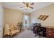 A home office features neutral paint, carpeted floors and a window with natural light at 327 Stone Valley Xing, Canton, GA 30114