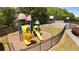 Community playground with slides and climbing features, adjacent to the basketball court at 327 Stone Valley Xing, Canton, GA 30114