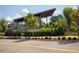 Modern community building with a sleek, angled roofline and lush landscaping, surrounded by trees and greenery at 3806 Jack Vernon Cir, Powder Springs, GA 30127